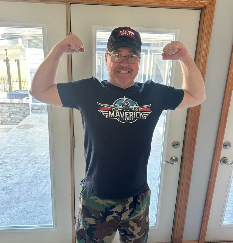 Maverick Strength Co. client showing enthusiasm for strength training